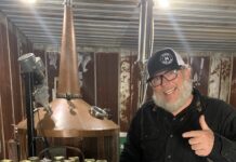 Business spotlight: Alabama Distillery Co. Patrick Watson, AKA Kat Daddy, stands in front of his beloved Shine Still, Big Lucy, at the Alabama Distillery Co. (Cheyenne Sharp)
