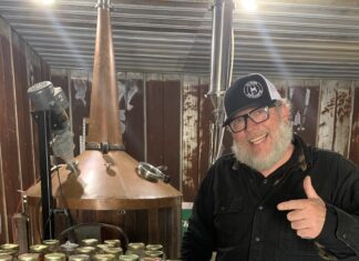 Business spotlight: Alabama Distillery Co. Patrick Watson, AKA Kat Daddy, stands in front of his beloved Shine Still, Big Lucy, at the Alabama Distillery Co. (Cheyenne Sharp)