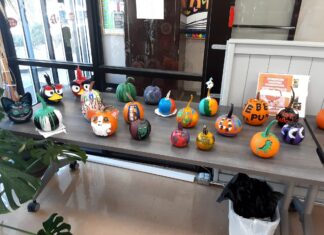 Painted pumpkins on display at library