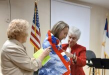 Army veteran Sgt. Candace Reppond receives Quilt of Valor