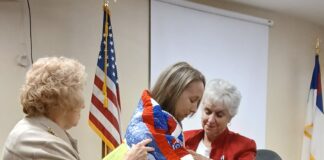 Army veteran Sgt. Candace Reppond receives Quilt of Valor