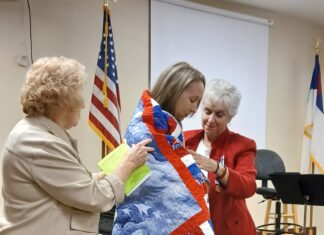 Army veteran Sgt. Candace Reppond receives Quilt of Valor