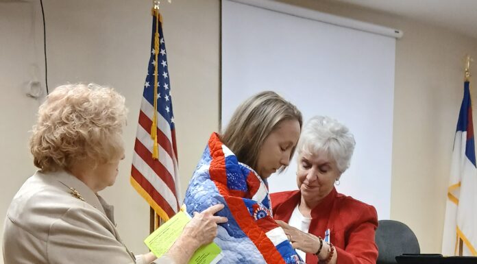 Army veteran Sgt. Candace Reppond receives Quilt of Valor