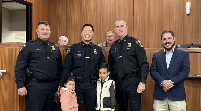 Cullman City Council, CPD announce promotions, new patrol major Intae Suh was promoted to major of investigation. Left to right are Assistant Chief Brandon Patterson, Taisley Suh, Major Intae Suh, Torrin Suh, Chief Joey Duncan and Councilman Brad Smith. (W.C. Mann for The Cullman Tribune)