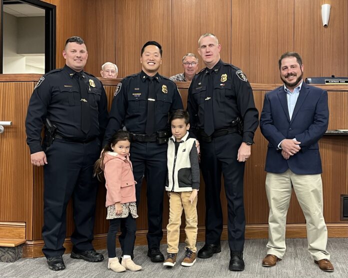 Suh Intae Suh was promoted to major of investigation. Left to right are Assistant Chief Brandon Patterson, Taisley Suh, Major Intae Suh, Torrin Suh, Chief Joey Duncan and Councilman Brad Smith. (W.C. Mann for The Cullman Tribune)