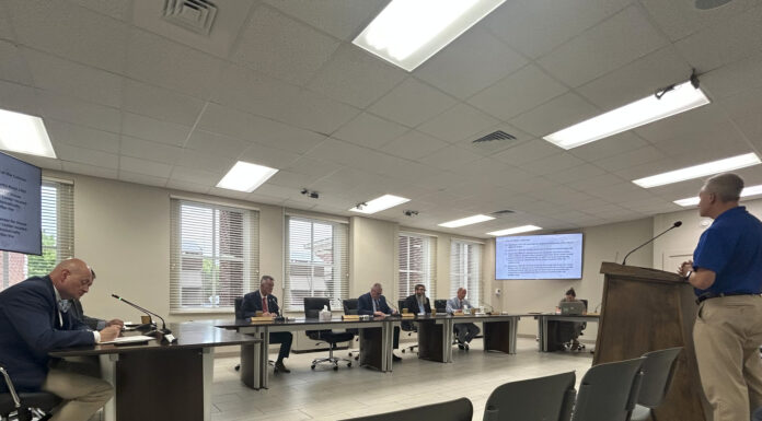 Commission approves airport bids, voting precinct change