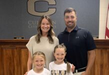PREP SOFTBALL: ‘This is where I feel like God led me’: Drew Bryson returning to Cullman to lead Bearcats softball team Samantha Bryson and Drew Bryson with their daughters Hadley and Bryleigh at the Wednesday, May 21, 2025, Cullman City School Board meeting (Nick Griffin)