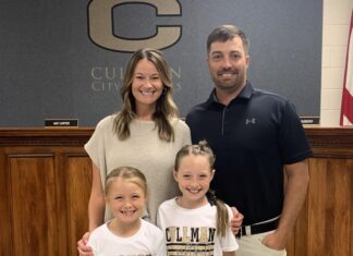 PREP SOFTBALL: ‘This is where I feel like God led me’: Drew Bryson returning to Cullman to lead Bearcats softball team Samantha Bryson and Drew Bryson with their daughters Hadley and Bryleigh at the Wednesday, May 21, 2025, Cullman City School Board meeting (Nick Griffin)