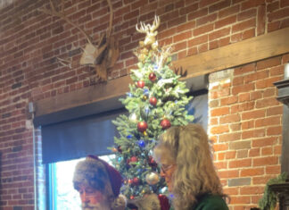Santa and Mrs. Claus stop by Karma’s Coffee House Santa reads “The Christmas Story” at Karma’s Coffee House on Sunday, Dec. 7, 2025. (Anabelle Howze/The Cullman Tribune)
