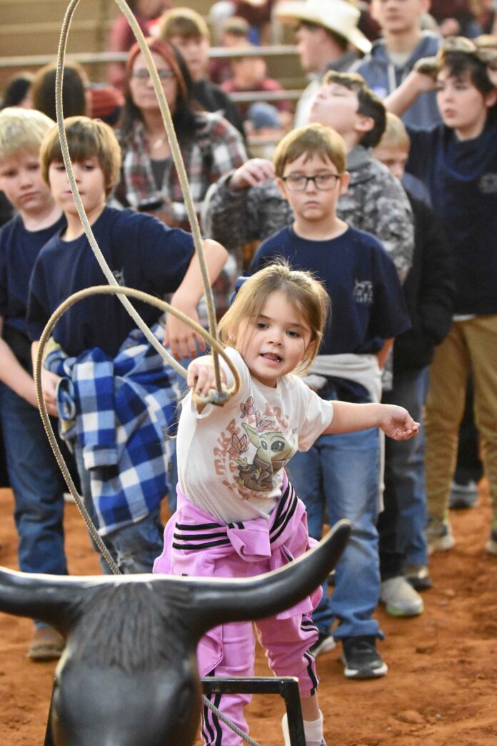 MAW_2582 A young girl is seen practicing her roping skills at the special needs rodeo on Thursday, Dec. 11, 2025, at the Cullman County Agricultural Trade Center. (Mike Witcher/The Cullman Tribune)