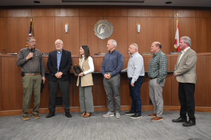 Mayor Woody Jacobs, left, and the Cullman City Council (including, left to right, Kim Hall, David Moss, Chuck Shikle, Paul Schaffer and Jason Willoughby) recognized the service of Cullman Economic Development Agency Director Dale Greer, second from left, at the Monday, Jan. 12, 2026, Cullman City Council meeting. (W.C. Mann/The Cullman Tribune)