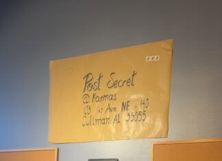 ‘Everyone has secrets’: PostSecret at Karma’s Postcard creation station in Karma’s Coffee House (Anabelle Howze/The Cullman Tribune)