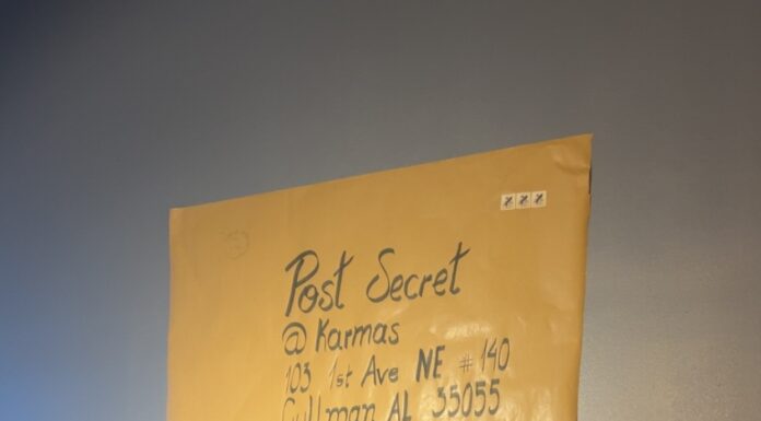 ‘Everyone has secrets’: PostSecret at Karma’s Postcard creation station in Karma’s Coffee House (Anabelle Howze/The Cullman Tribune)